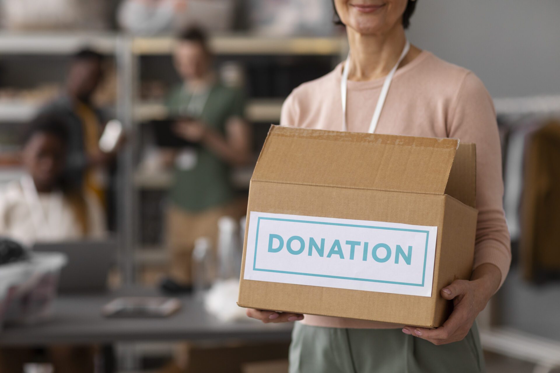 volunteer-helping-with-donation-box